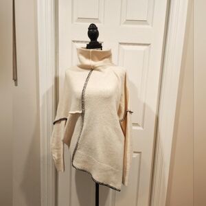 Elegant Cream and Black Turtleneck Sweater with Asymmetrical Design